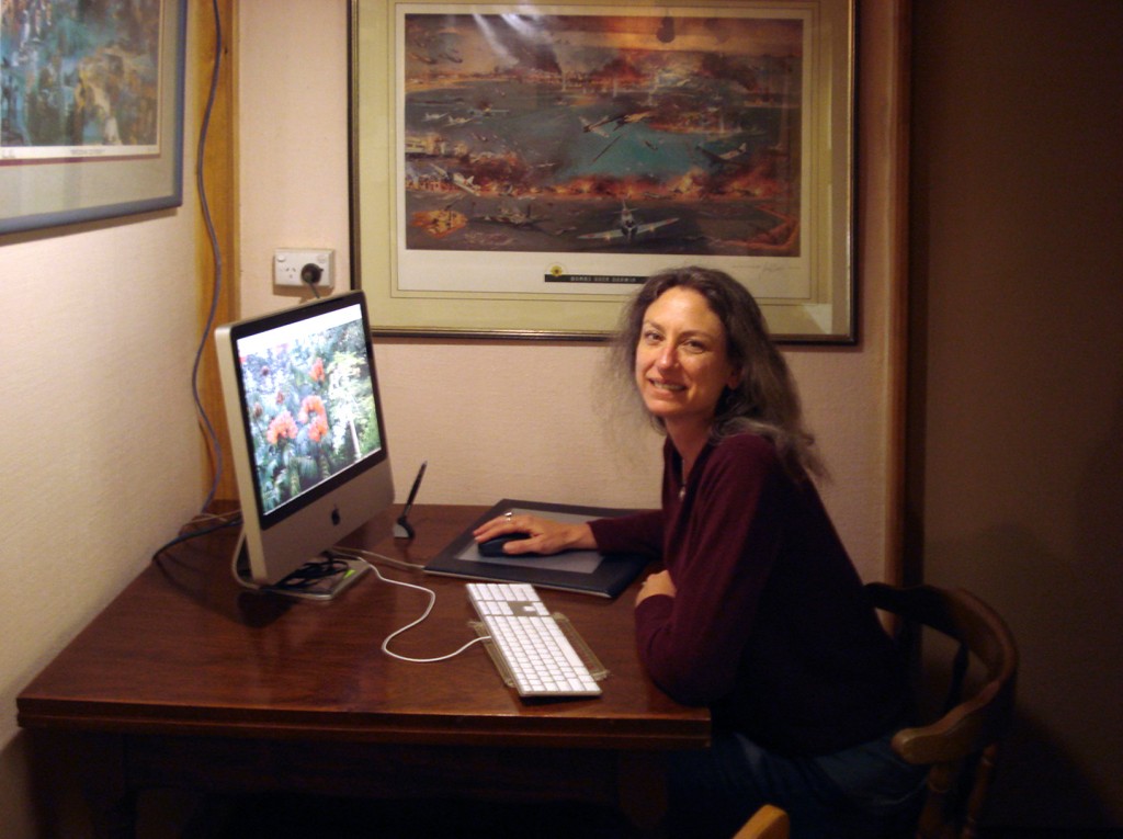 About Hannah WEst : Picture of web designer hannah west at her computer, working for clients in the US during a trip to Australia